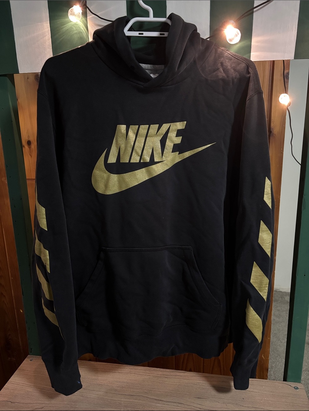 Nike Black Hoodie with Gold Swoosh and Sleeve Accents